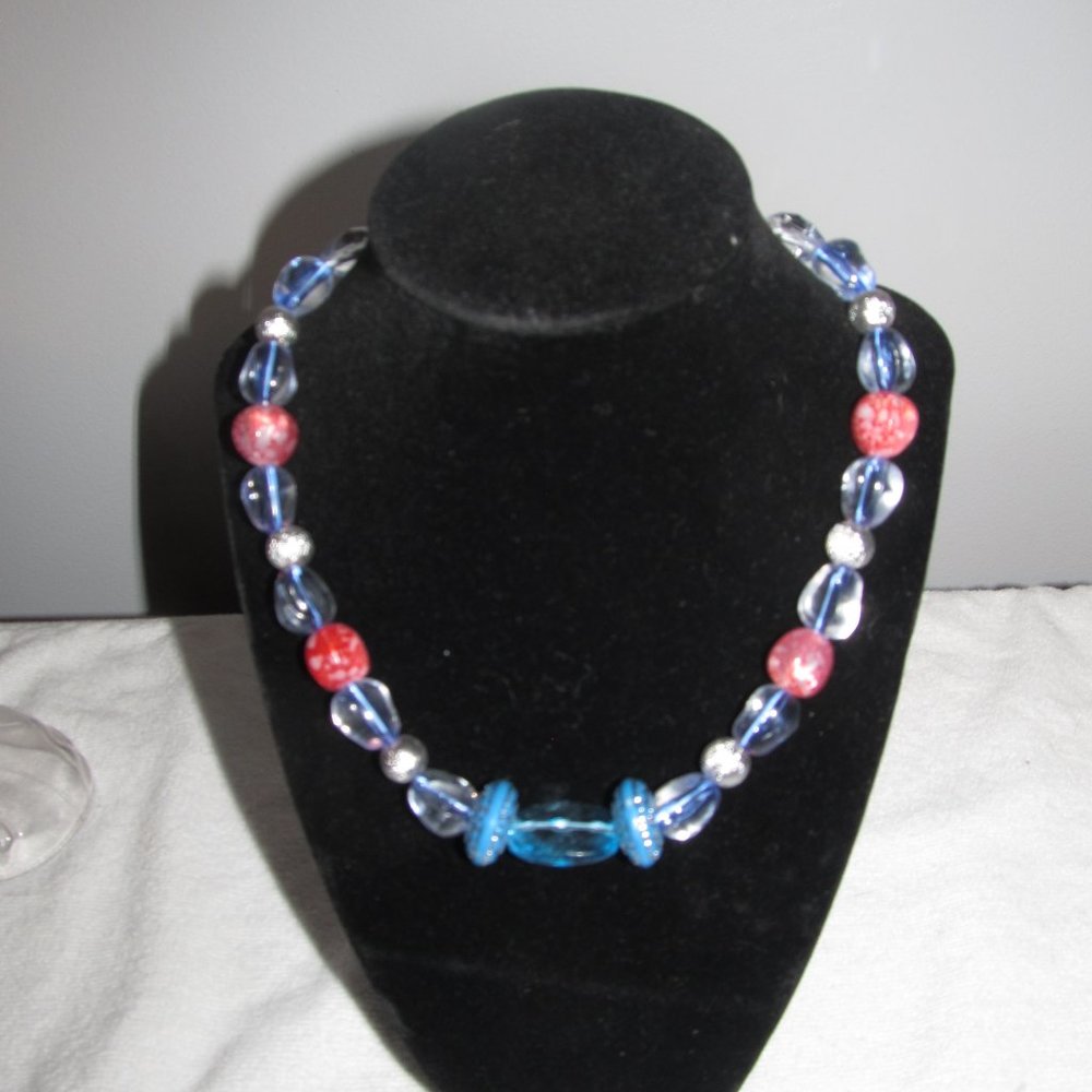 Clear blue w/red splash